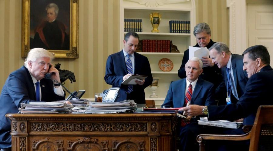 U.S. President Donald Trump (L-R), is joined by Chief of Staff Reince Priebus, Vice President Mike Pence, senior advisor Steve Bannon, Communications Director Sean Spicer and National Security Advisor Michael Flynn, as he speaks by phone with Russia's President Vladimir Putin in the Oval Office at the White House in Washington, U.S., January 28, 2017. Jonathan Ernst: "Very early in the Trump administration, weekends were as busy as weekdays. On Trump's second Saturday the official schedule said he would be making private phone calls to a number of world leaders including Russia's Vladimir Putin. I arrived early and, before sitting down at my desk walked up to Press Secretary Sean Spicer's office. He, too, was just taking his coat off. I gingerly made the suggestion that previous administrations had sometimes allowed photos of such phone calls through the Oval Office windows on the colonnade. To my mild shock, he didn't even think about it twice. "We'll do it!" he said. In truth, I really only expected the Putin call, but we were outside the windows multiple times throughout the day as the calls went on." President Donald Trump,Donald Trump,US President Donald Trump,Donald Trump viral moments