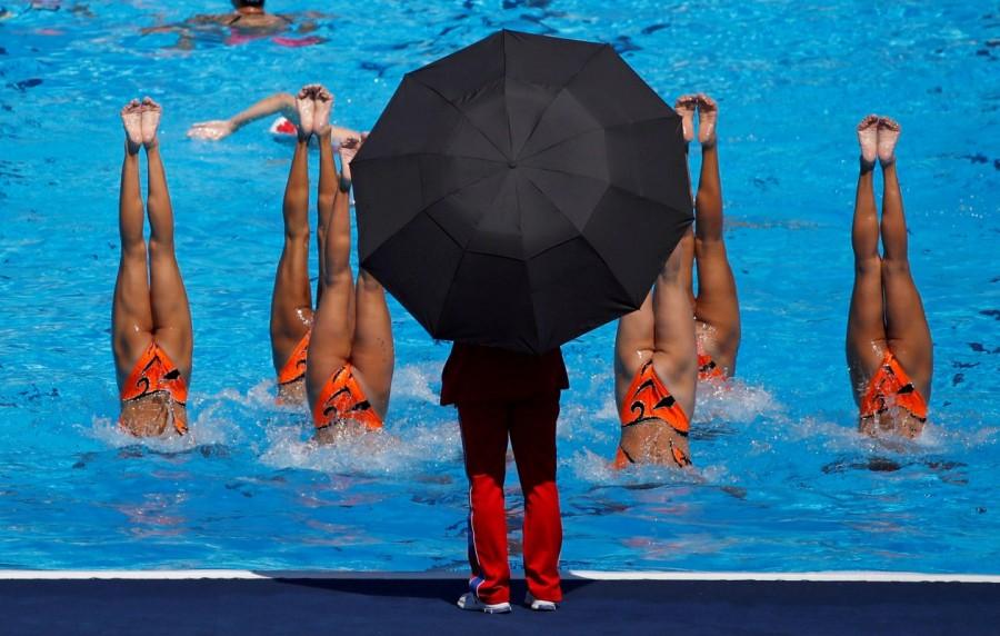 North Korea's synchronised swimming team practice under coach supervision during the World Aquatics Championships, Team Technical Final in Budapest, Hungary, July 18, 2017. Great sports photos,sports photos of 2017,photos from around the world in 2017