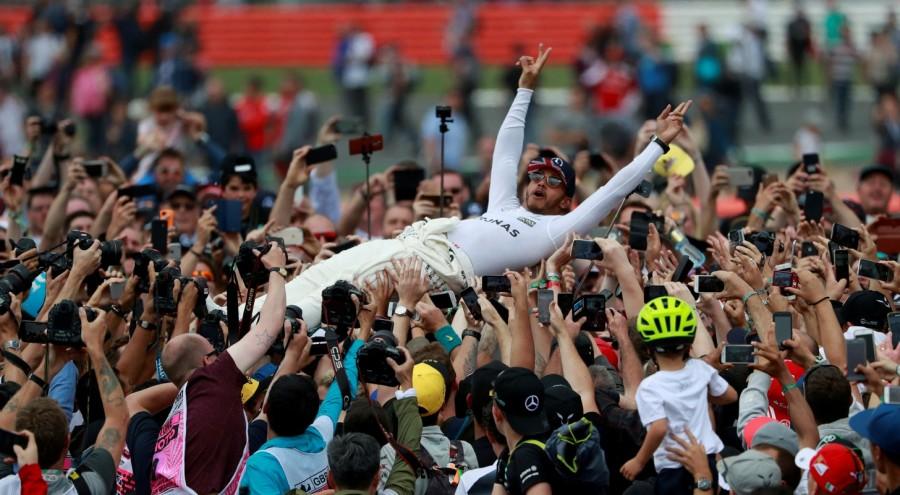 Mercedes' Lewis Hamilton celebrates with fans after winning the 2017 Formula One British Grand Prix at Silverstone, Britain, July 16, 2017. Great sports photos,sports photos of 2017,photos from around the world in 2017