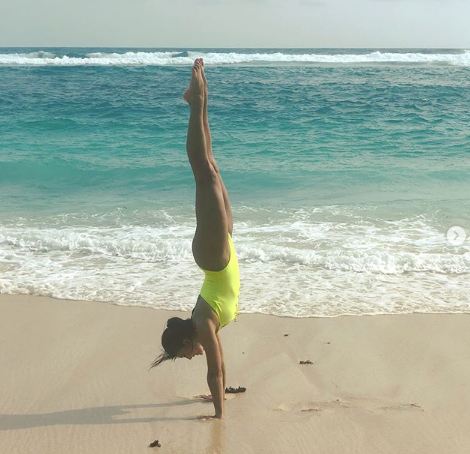 Jacqueline set the temperature soaring by sharing pictures on her social media handle giving the masses major holiday and fitness goals. The Race actress earlier posted a video of herself surfing the waves and now she has posted pictures of herself doing a headstand on the sand. The actress teased her fans with pictures captioning, "Vitamin Sea". Sizzling Jacqueline Fernandez,hot Jacqueline Fernandez,Jacqueline Fernandez flaunts her beach body,Jacqueline Fernandez flaunts her body,Jacqueline Fernandez beach body,Jacqueline Fernandez swimsuit