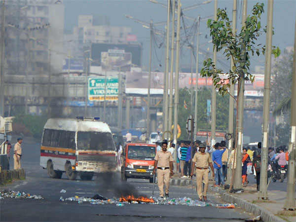 Groups of Dalit activists jumped on the railway tracks, shouting slogans and waving flags to attempt a rail-blockade at Thane and Virar stations in Palghar, but were prevented by the security forces. Bhima Koregaon riots,Bhima Koregaon violence,Bhima Koregaon,pune man death,pune violence,mumbai violence,mumbai police,chembur violence,mumbai traffic jam,eastern express highway,Mumbai