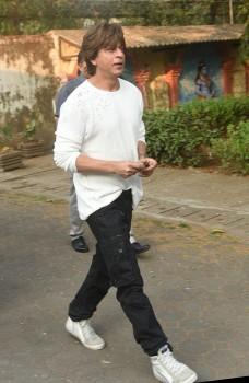 Bollywood actor Shah Rukh Khan arrives to pay his last respects to actor Nikhil Dwivedi's father during the funeral ceremony in Mumbai.