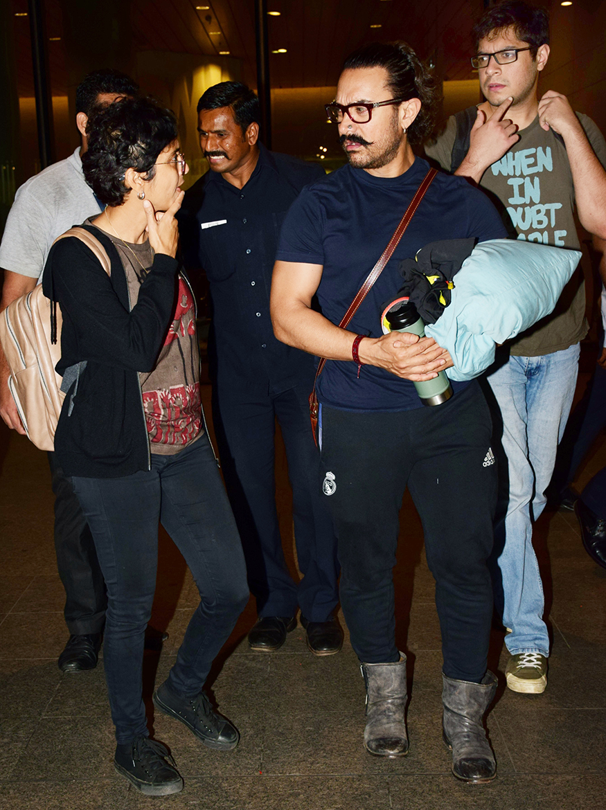 Actor Aamir Khan spotted at the airport with his wife Kiran Rao and son Azad Rao Khan while returning to Mumbai after New Year celebrations. Aamir Khan,actor Aamir Khan,Azad Rao Khan,Kiran Rao,Aamir Khan returns to Mumbai,Aamir Khan returns to Mumbai after New Year celebrations,Aamir Khan New Year celebration,Junaid Khan