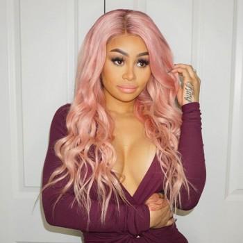 American model Blac Chyna flaunts her pink neon hair and ample cleavage in racy Instagram posts.