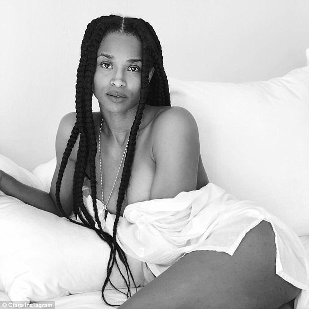 Singer Ciara shares racy bedroom stills. Ciara,model Ciara,Ciara racy bedroom selfie,racy nude selfie,racy nude,racy hot selfie,Russell Wilson,Ciara unbuttons herself