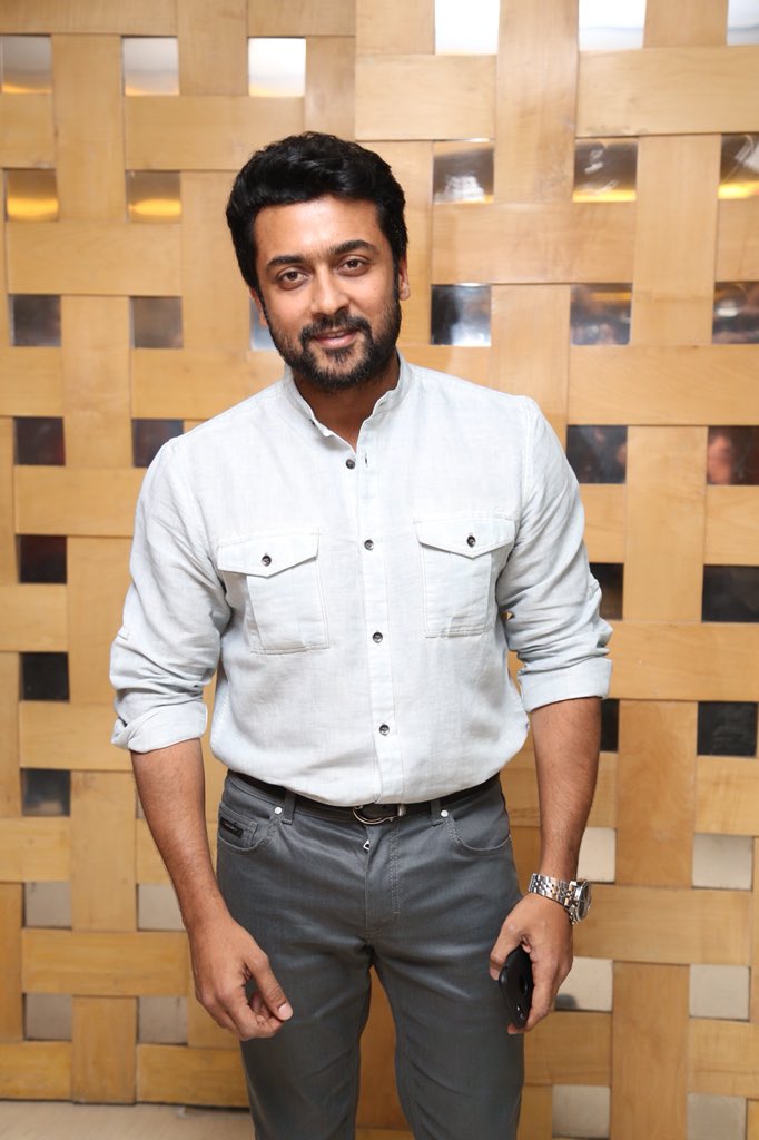 Suriya poses for the cameras during Thaana Serndha Kootam press meet. Suriya,Keerthy Suresh,Ramya Krishnan,Vignesh Shivan,Thaana Serndha Kootam,Thaana Serndha Kootam press meet,TSK press meet,Thaana Serndha Kootam press meet pics,Thaana Serndha Kootam audio launch,Thaana Serndha Kootam press meet images