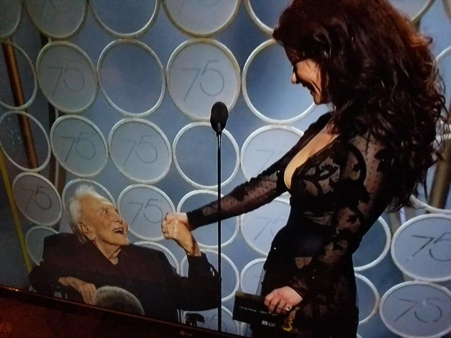 Before he came on the stage in his wheelchair, a montage of Douglas' career with highlights like scenes from "Spartacus", "Lust for Life" and "Detective Story" was played. He became a part of the gala to present the award for Best Motion Picture Screenplay with Zeta-Jones. Everyone got up and clapped as an appreciation to his contribution to the cinema and welcomed him on the stage on Sunday here. Kirk Douglas,actor Kirk Douglas,Kirk Douglas at Golden Globes,Golden Globes,Hollywood legend Kirk Douglas,Catherine Zeta-Jones