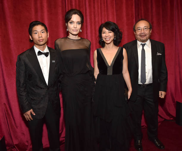 Pax Jolie-Pitt, Angelina Jolie and Loung Ung attend the Netflix Golden Globes after party at Waldorf Astoria Beverly Hills on January 7, 2018 in Beverly Hills, California. Angelina Jolie,Angelina Jolie son,Angelina Jolie son Maddox,Maddox,Angelina Jolie at Golden Globes 2018,Golden Globes 2018,celebs at Golden Globes 2018