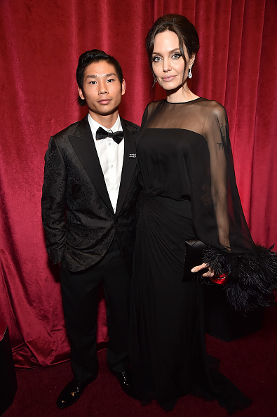 Pax Jolie-Pitt and Angelina Jolie attend the Netflix Golden Globes after party at Waldorf Astoria Beverly Hills on January 7, 2018 in Beverly Hills, California. Angelina Jolie,Angelina Jolie son,Angelina Jolie son Maddox,Maddox,Angelina Jolie at Golden Globes 2018,Golden Globes 2018,celebs at Golden Globes 2018