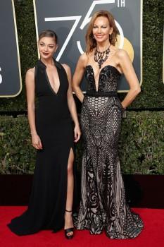 Miss Universe 2017 Demi-Leigh Nel-Peters (L) and journalist Margaret Gardiner attend The 75th Annual Golden Globe Awards at The Beverly Hilton Hotel on January 7, 2018 in Beverly Hills, California.