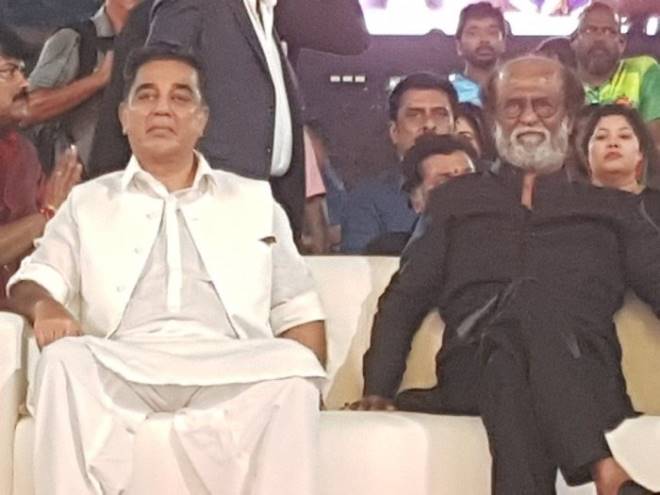 The two arrived at a stadium here in a helicopter and drove together in a golf cart for some distance. They shook hands and then acknowledged the cheers from their fans gathered at the stadium. Rajnikanth and Kamal Haasan,Rajnikanth,Kamal Haasan,Natchathira Vizha,Natchathira Vizha 2018,Natchathira Vizha in Kuala Lumpur