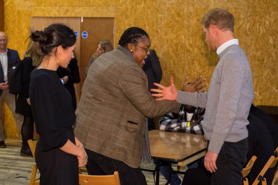 Britain's Prince Harry and his fiancee Meghan Markle meet DJ Remi Aderemi during a visit to radio station Reprezent FM, in Brixton, London. Meghan Markle and Prince Harry,Meghan Markle,Prince Harry,Prince Harry visit radio station,Meghan Markle visit radio station