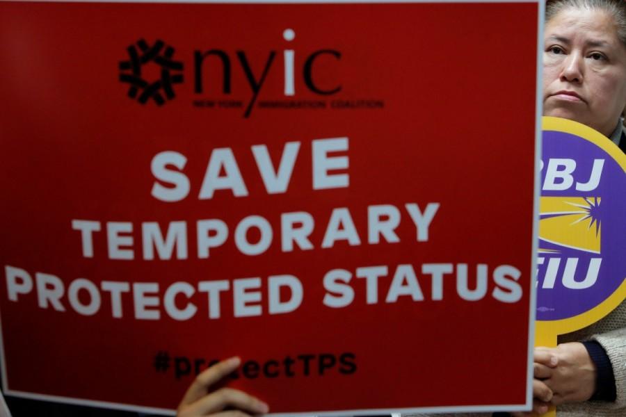 Salvadoran immigrant Minda Hernandez watches during a news conference at the New York Immigration Coalition in Manhattan. Salvadoran immigrants,U.S. protest,United States,Trump administration