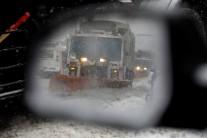 A snowplow is seen in a car's side mirror in upper Manhattan during Storm Grayson in New York City, New York, U.S., January 4, 2018.