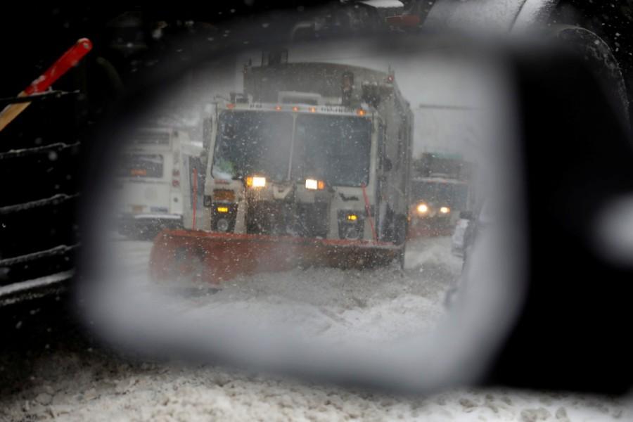 A snowplow is seen in a car's side mirror in upper Manhattan during Storm Grayson in New York City, New York, U.S., January 4, 2018. U.S. Northeast,Blizzard roars,Blizzard roars in US