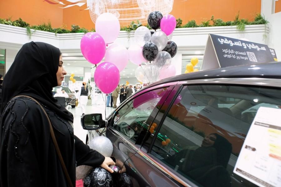 A Saudi woman checks a car at the first automotive showroom solely dedicated for women in Jeddah, Saudi Arabia. Saudi Arabia,women in Jeddah,car showroom,women car showroom,Saudi Arabia women car showroom,women car showroom in Saudi Arabia,Jeddah