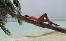 Alesha Dixon shows off toned figure in vibrant bikini.
