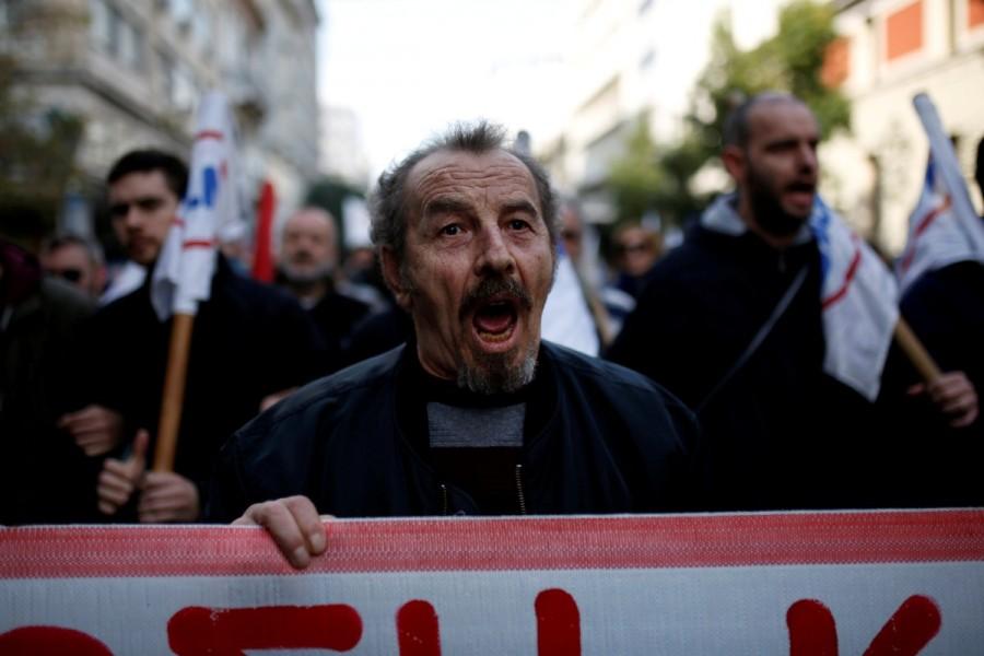 Protesters from the communist-affiliated trade union PAME shout slogans during a demonstration against planned government reforms in Athens. Protests and clashes,Protests in Athens,clashes in Athens,Athens parliament