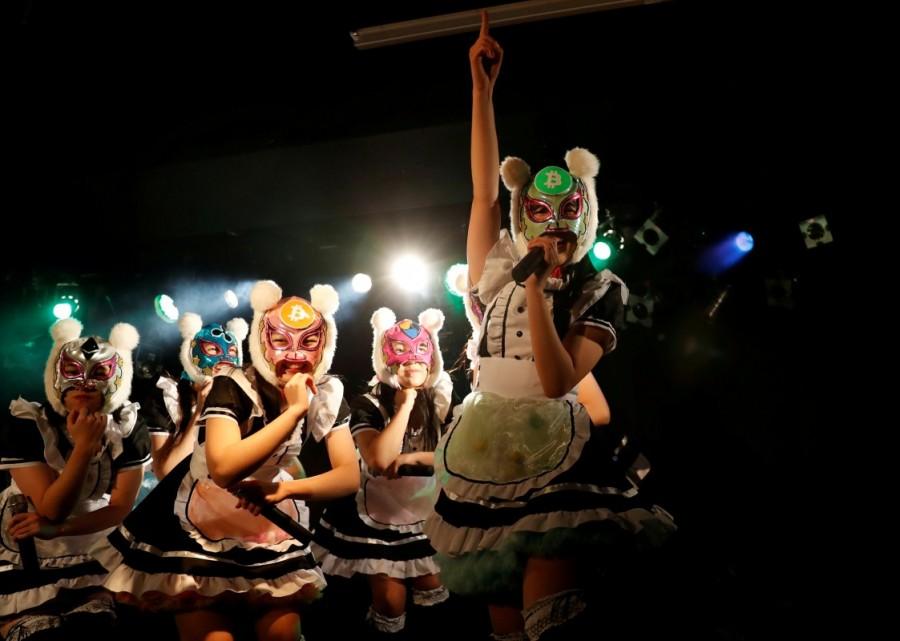 Members of Japan's idol group "Virtual Currency Girls" wearing cryptocurrency-themed masks perform in their debut stage event in Tokyo. Virtual Currency Girls,Japan's Virtual Currency Girls,Japan's newest idol group,Japan new idol group