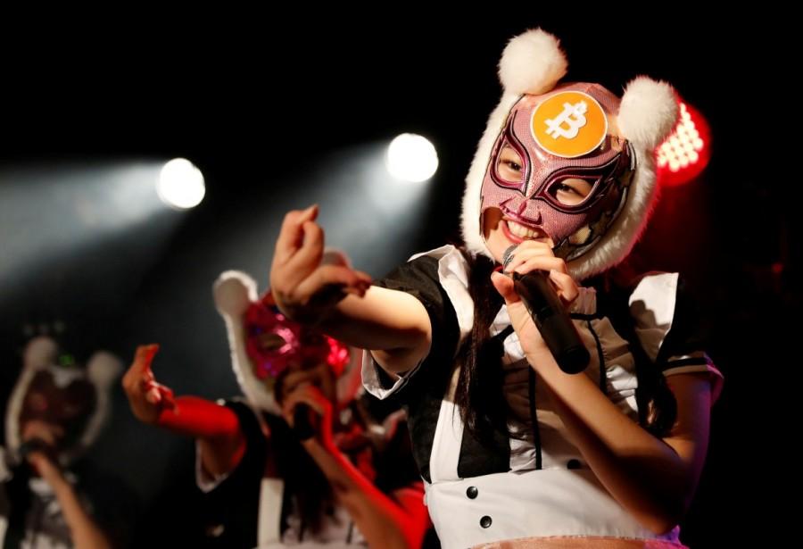Members of Japan's idol group "Virtual Currency Girls" wearing cryptocurrency-themed masks perform in their debut stage event in Tokyo. Virtual Currency Girls,Japan's Virtual Currency Girls,Japan's newest idol group,Japan new idol group