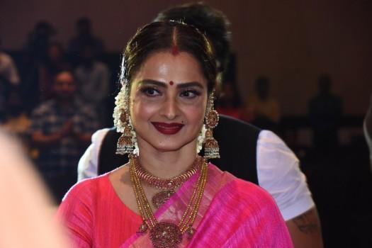 Rekha poses for photographers on her arrival at the 'Society Achievers Awards 2018' in Mumbai.