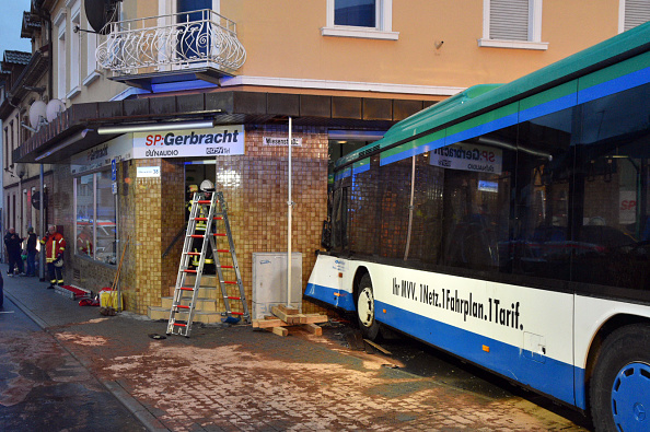 View of a schoolbus that crashed into a shop on early January 16, 2018 in the southern German town of Eberbach, near Heideleberg. At least 47 people were injured in the accident, ten of them seriously. Germany school bus crash,Germany school bus,school bus crash,school bus accident