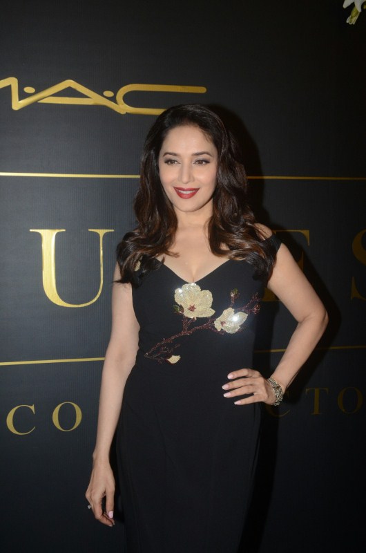 Madhuri Dixit Nene poses for photographers on her arrival at Mickey Contractor's MAC party in Mumbai. Karan Johar,Jaya Bhaduri Bachchan,Madhuri Dixit,Dia Mirza,Mickey Contractor's MAC Party,Mickey Contractor's MAC Party pics,Mickey Contractor's MAC Party images,Mickey Contractor's MAC Party stills,Mickey Contractor's MAC Party pic