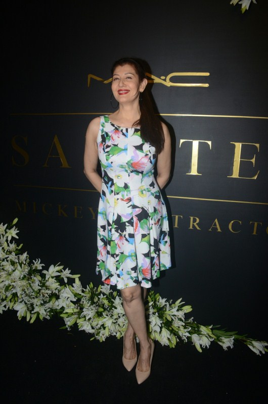 Sangeeta Bijlani poses for photographers on her arrival at Mickey Contractor's MAC party in Mumbai. Karan Johar,Jaya Bhaduri Bachchan,Madhuri Dixit,Dia Mirza,Mickey Contractor's MAC Party,Mickey Contractor's MAC Party pics,Mickey Contractor's MAC Party images,Mickey Contractor's MAC Party stills,Mickey Contractor's MAC Party pic