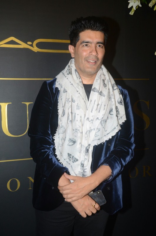 Fashion Designer Manish Malhotra poses for photographers on her arrival at Mickey Contractor's MAC party in Mumbai. Karan Johar,Jaya Bhaduri Bachchan,Madhuri Dixit,Dia Mirza,Mickey Contractor's MAC Party,Mickey Contractor's MAC Party pics,Mickey Contractor's MAC Party images,Mickey Contractor's MAC Party stills,Mickey Contractor's MAC Party pic