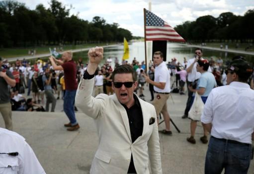 White nationalist leader Richard Spencer (C) chants back at counter-protestors as self-proclaimed 
