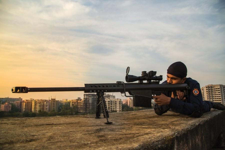 Quick Response Team sniper: Nothing distracts a committed policeman from aiming for an evil eye. Amitabh Bachchan,actor Amitabh Bachchan,Mumbai Police 2018 Calendar,Mumbai Police Calendar,Amitabh Bachchan unveils Calendar,Mumbai Police