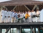 Bieber, 23, shared an image on Instagram of the duo posing with staff on a dock above the water, with Mallette sitting on a wheelchair on the first day of their luxury retreat, reports dailymail.co.uk. Surrounded by smiling staff dressed in all-white, Bieber is bent down on one knee and pointing toward the camera while wearing a bright yellow hoodie and comfortable grey sweatpants.