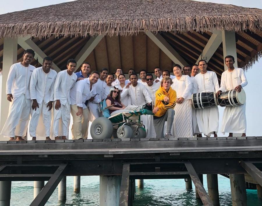 Bieber, 23, shared an image on Instagram of the duo posing with staff on a dock above the water, with Mallette sitting on a wheelchair on the first day of their luxury retreat, reports dailymail.co.uk. Surrounded by smiling staff dressed in all-white, Bieber is bent down on one knee and pointing toward the camera while wearing a bright yellow hoodie and comfortable grey sweatpants. Justin Bieber,singer Justin Bieber,Pattie Mallette,Justin Bieber mother,justin bieber mother pattie,Justin Bieber in Maldives