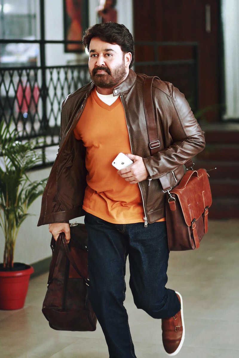 Mohanlal, who is known for Malayalam films like "Oppam" and "Iruvar", shared his look from the film on Twitter. In the photograph he is seen in a brown jacket paired with an orange cardigan and a brown bag holding a phone on his left hand. Mohanlal tweeted on Tuesday: "Morning friends, as you all know I'm currently in Mumbai shooting for my new film by Ajoy Varma. I'm thrilled to be playing the central character of this movie that is packed with a lot of action and adventure. Take a look at the first look poster of this action movie,". Mohanlal,actor Mohanlal,Mohanlal new movie,Mohanlal and Ajoy Verma,Ajoy Verma