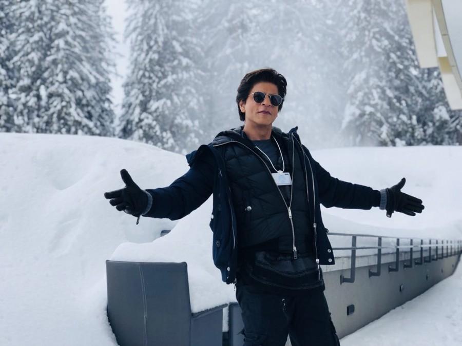 Superstar Shah Rukh Khan, who is in Davos to receive an honour at the 24th Annual Crystal Awards, recreated his signature open arms pose here in a middle of a snow clad path. Excited to be here, Shah Rukh tweeted an image of himself recreating the iconic pose and captioned it: "Switzerland main aake yeh na kiya toh kya kiya...?! Loving being at the Davos, now to get ready for the Crystal Award Ceremony. Davos Diaries". Shah Rukh Khan,actor Shah Rukh Khan,SRK,Shah Rukh Khan pose Davos,Shah Rukh Khan pose in Davos,Crystal Awards,24th Annual Crystal Awards