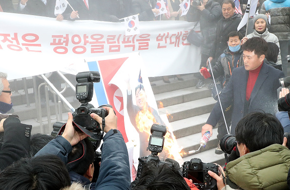 South Korea's presidential office on Tuesday also released a statement seeking public support for North Korea's participation in the PyeongChang Games and reiterated President Moon Jae-in's position that it will bring about stability and peace on the Korean peninsula. South Korea,South Korea burns Kim Jong-un,South Korea burns Kim Jong-un photo,South Korea burns North's flag,Pyongyang,Winter Olympic Games