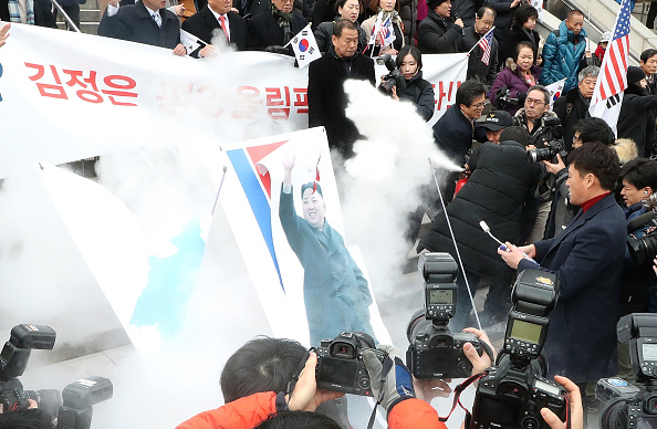 The statement urged that the North's delegation for the Games, which are scheduled to begin on February 9, be welcomed warmly into the country. South Korea,South Korea burns Kim Jong-un,South Korea burns Kim Jong-un photo,South Korea burns North's flag,Pyongyang,Winter Olympic Games