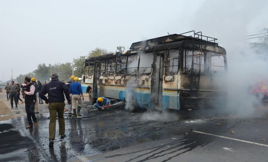 A Haryana Roadways bus was set ablaze and another vandalised in Bhondsi area in Gurugram district by a group of around 50 men, alleged to be Shri Rajput Karni Sena supporters, on Wednesday to protest against the movie 'Padmaavat'. They also pelted stones at the Haryana Police personnel deployed on the Gurugram-Alwar National Highway, injuring a few policemen. A school bus carrying children and staff was also damaged in stone-pelting, though no one was said to be injured. Haryana Roadways,Padmaavat protests,Padmaavat movie protests,padmaavat release,padmaavat controversy,Shri Rajput Karni Sena,Karni Sena
