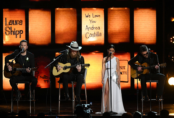 Country singers Maren Morris, Eric Church, and Brothers Osborne performed a moving rendition of Eric Clapton's Grammy winning "Tears in Heaven" at the 60th Grammy Awards here as a tribute to victims of a mass shooting at a music fest in Las Vegas last year. The artistes had performed at last year's Route 91 Harvest Festival, where at least 58 people were killed when a gunman opened fire from the 32nd of a hotel, on the crowd in October. It was one of the deadliest mass shooting in the recent US history. T.J. Osborne,John Osborne,Maren Morris,Eric Church,Tears in Heaven,60th Annual GRAMMY Awards,Grammys 2018,Grammys awards