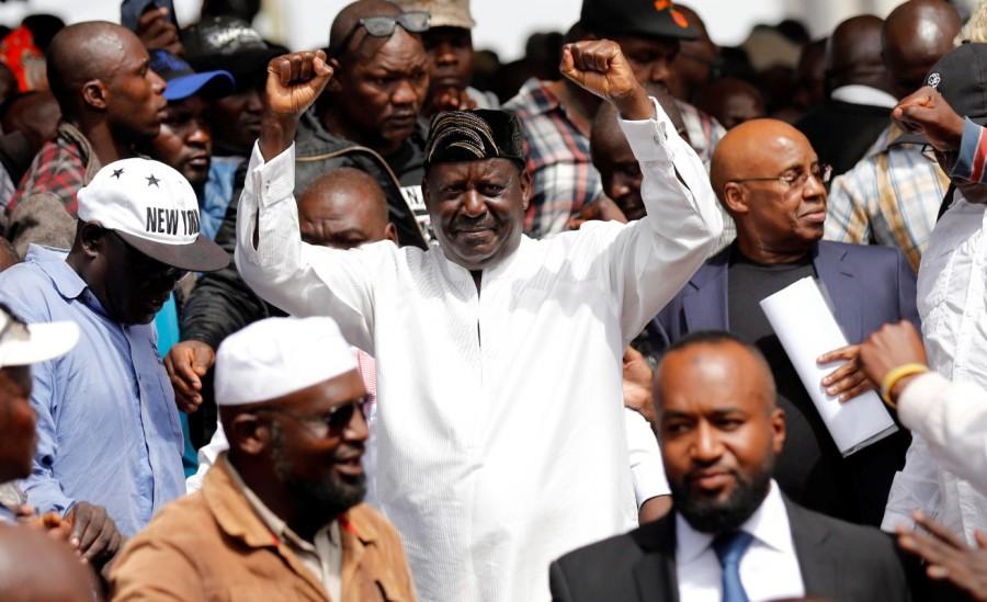Raila Odinga gestures during a swearing-in ceremony as the president of the People's Assembly. The movement is a loose grouping led by Odinga and other lawmakers that tried to rally support in November for a boycott of some products whose owners it says are aligned with government interests. Raila Odinga,Kenya opposition leader,President Uhuru Kenyatta,Uhuru Kenyatta