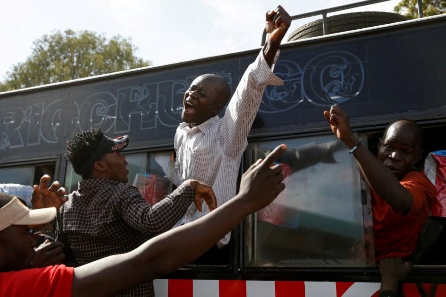 Supporters of Raila Odinga gesture through a bus window ahead of his planned swearing-in ceremony. Odinga's supporters say he is Kenya's legitimate leader and Kenyatta's election was neither free nor fair. Kenyatta's victory in August was annulled by the Supreme Court over irregularities but he then won a re-run, which Odinga boycotted over a failure to revamp the electoral commission. Kenyatta was sworn in for a second term in November and state institutions report to him. Raila Odinga,Kenya opposition leader,President Uhuru Kenyatta,Uhuru Kenyatta