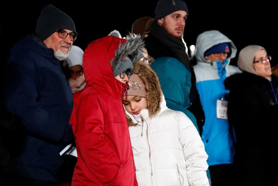 Family members of the victims hug each other during the vigil. Quebec City mosque,Quebec mosque shooting,Justin Trudeau,Quebec City