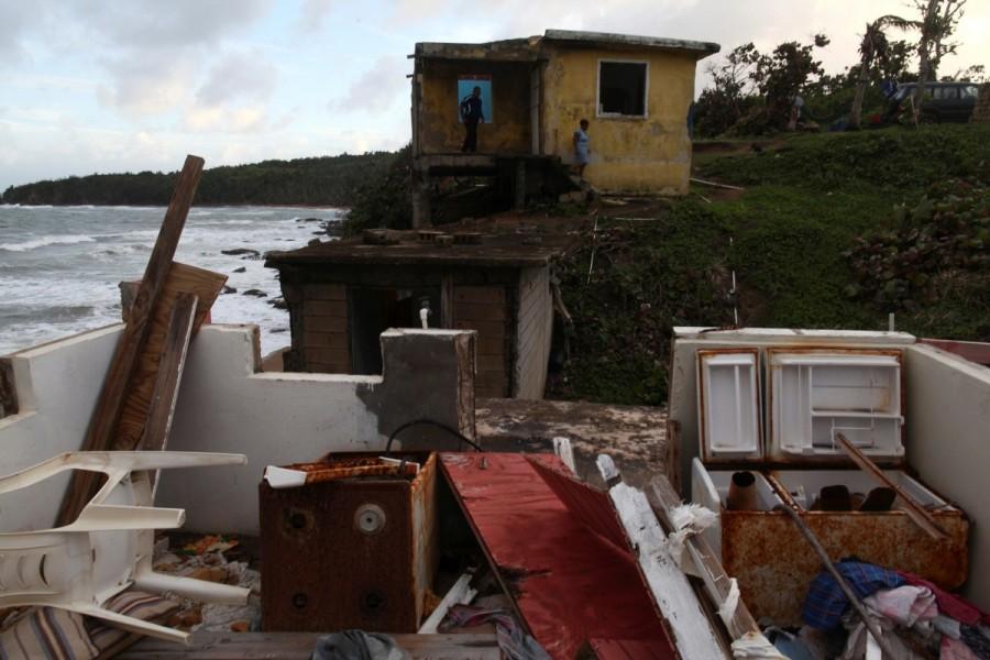 The remains of a house are seen in the El Negro neighbourhood in Maunabo. Hurricane Maria,Hurricane Maria Puerto Rico,Puerto Rico struggles,Puerto Rico,Puerto Rico electricity,Puerto Rico Hurricane Maria irma,Puerto Rico food and water