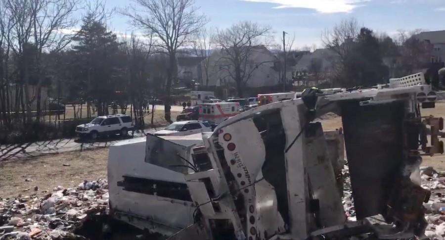 A view of the scene following the accident, in this picture grab obtained from a social media video. Amtrak passenger train,Amtrak train,Virginia,Virginia road crossing,garbage truck