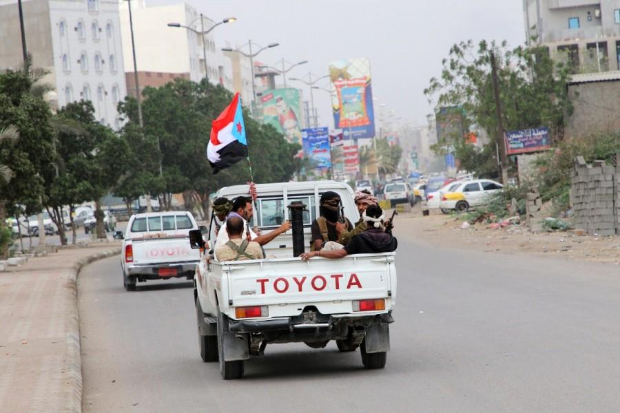 Southern Yemeni separatist fighters ride on the back of a patrol truck in the port city of Aden, Yemen January 31, 2018. Yemen,Yemen separatists,Aden