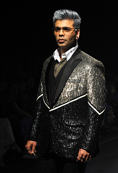 Indian Bollywood film director Karan Johar showcases a creation by designer Falguni Shane Peacock at the Lakmé Fashion Week (LFW) Summer Resort 2018 in Mumbai on February 2, 2018. Lakme Fashion Week 2018,lakme fashion week,Karan Johar and Sonakshi Sinha,Karan Johar,Sonakshi Sinha,Falguni and Shane Peacock