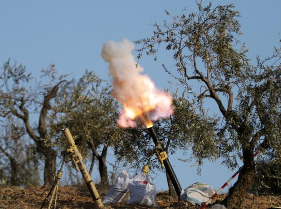 Turkey-backed Free Syrian Army fighters fire a mortar in Barsaya mountain, northeast of Afrin, Syria January 28, 2018. Turkish,Turkish forces,U.S.-backed Kurdish,YPG fighters,Afrin region