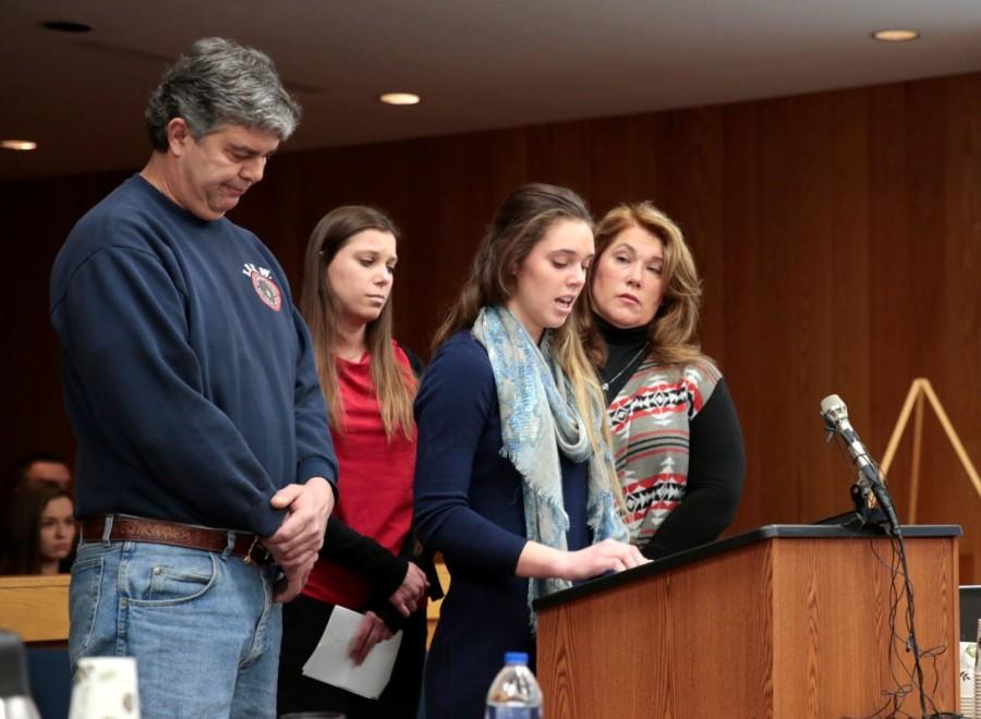 The chaotic scene began after sisters Lauren and Madison Margraves (pictured speaking) had finished tearfully reading their victim statements on the second day of hearings at a court in Eaton County, much as nearly 200 women have done before them at earlier hearings. Standing alongside his daughters and wife, Randall Margraves, a tall man with an intense gaze dressed in an electricians' union sweatshirt, then asked to speak. Larry Nassar lunges,Larry Nassar lunges father,Larry Nassar in Court