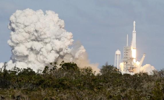 A SpaceX Falcon Heavy rocket lifts off from historic launch pad 39-A at the Kennedy Space Center in Cape Canaveral, Florida.