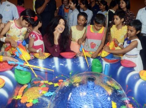 Rituparna Sengupta with children during the inauguration of Whooppee indoor amusement park.